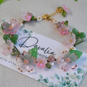 Davalia pink floral bracelet on its branded jewelry card